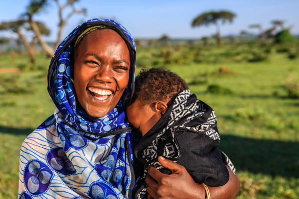 Woman carrying her child